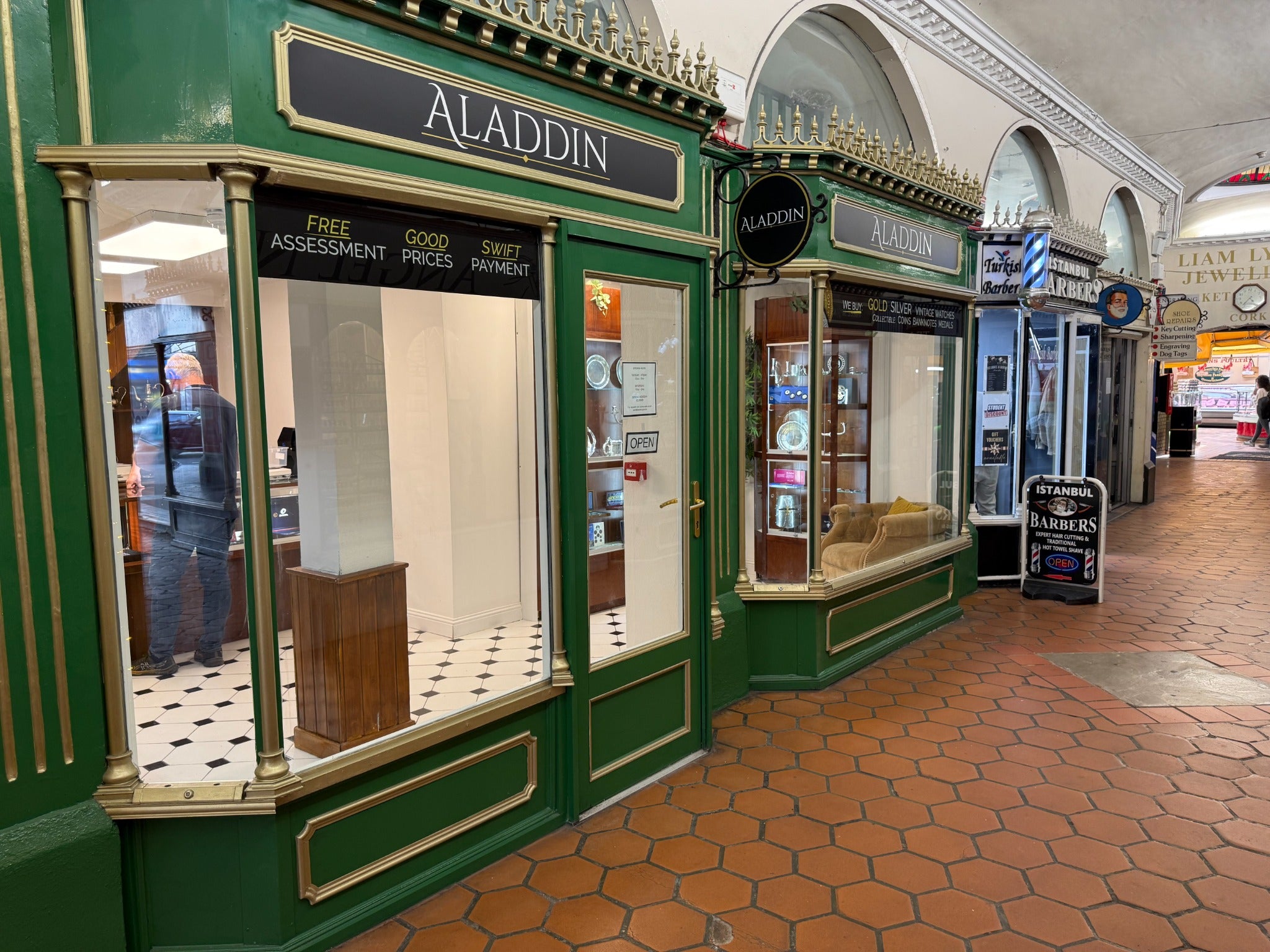 Aladdin Cork’s green and gold shopfront inside Market Parade