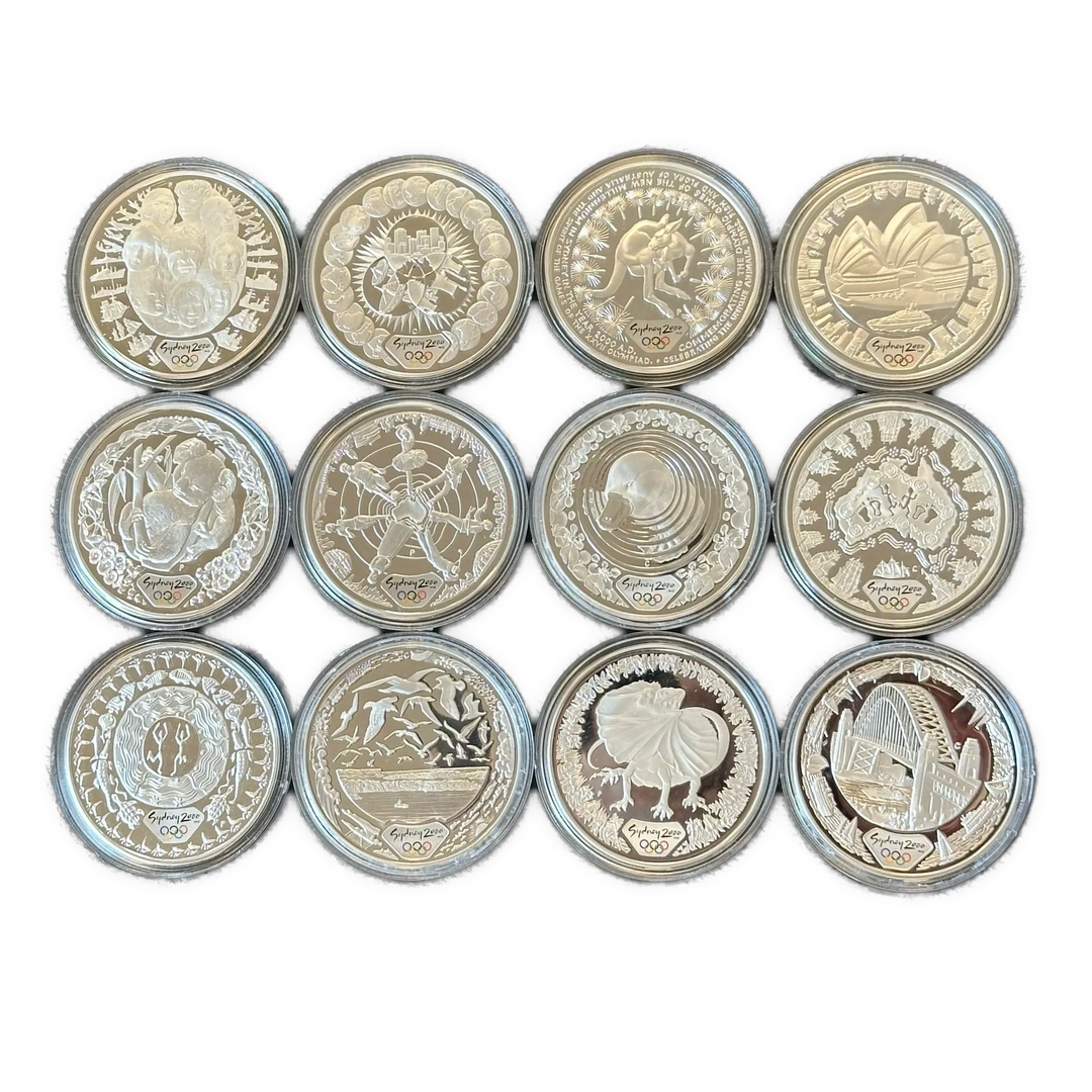12oz .999Ag (Net) SPOT+2% Diverse minnemynter Sydney OL 2000