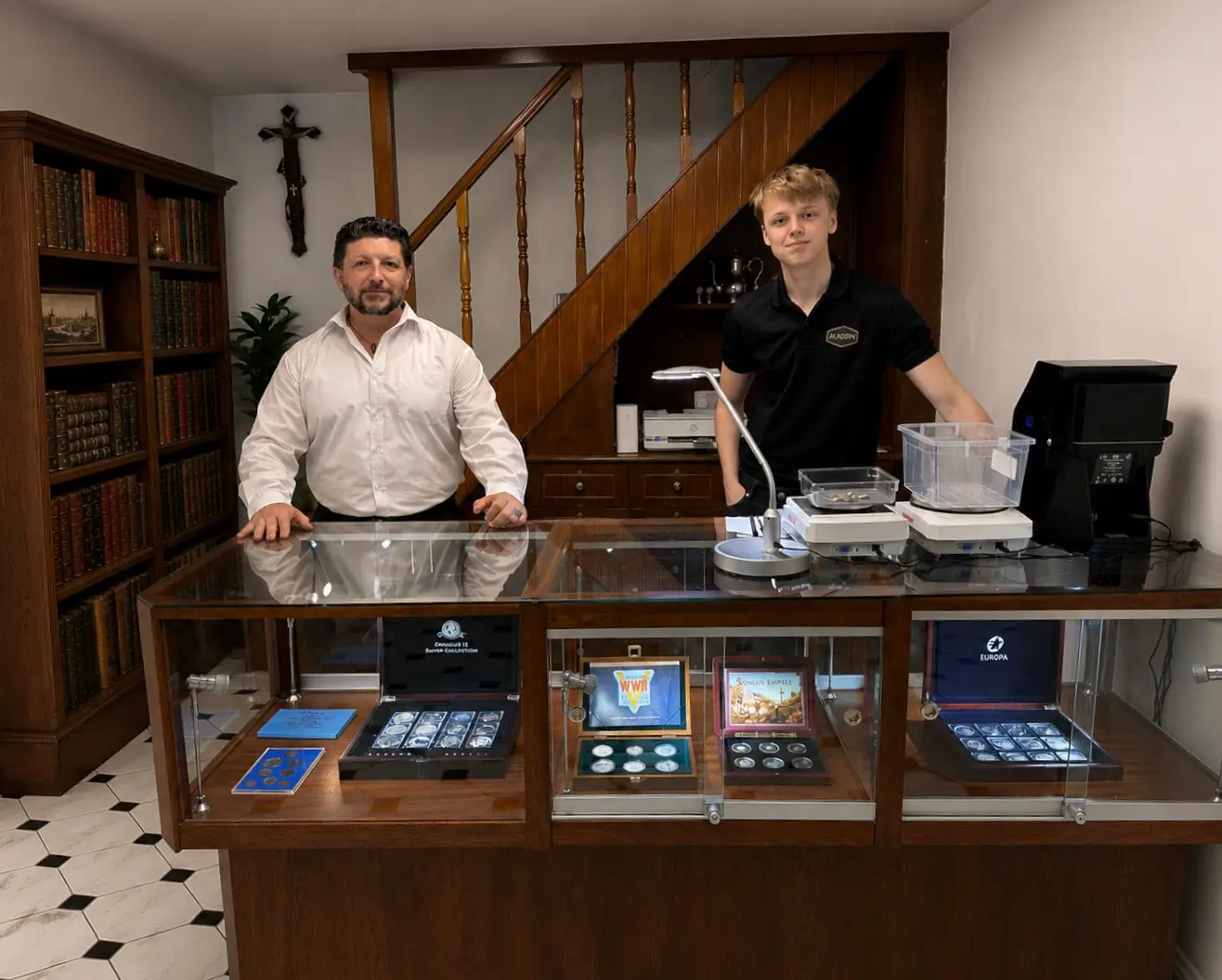 The Aladdin Cork team behind the counter with collectible coins on display