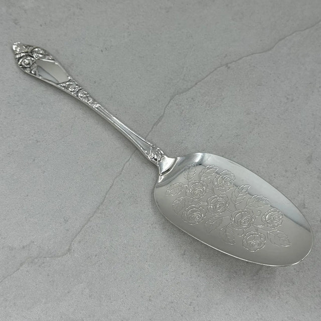 Opphøiet rose kakespade 21cm